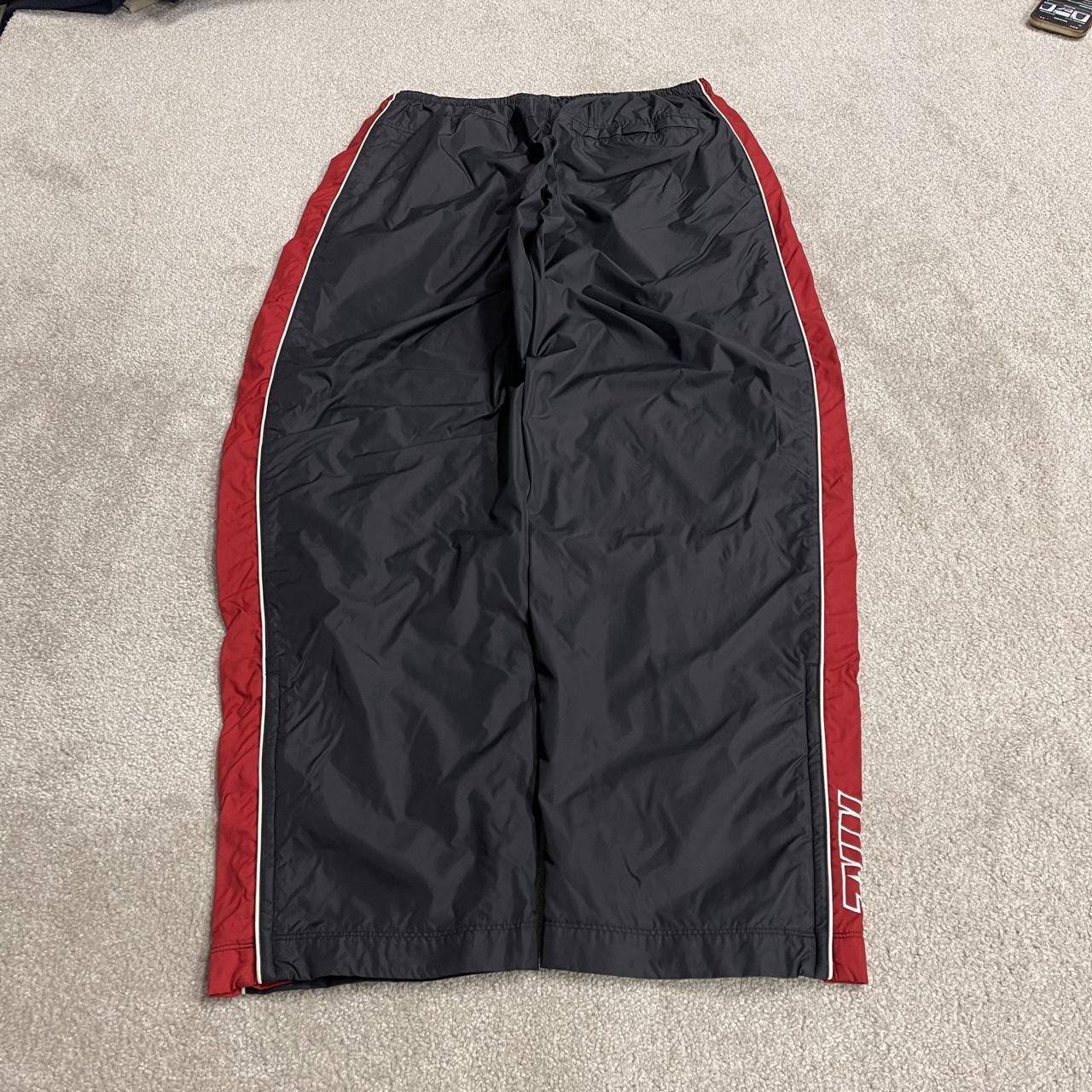 Vintage Nike baggy tracksuit bottoms Y2K black Wide leg lined embroidered side stripe track pants