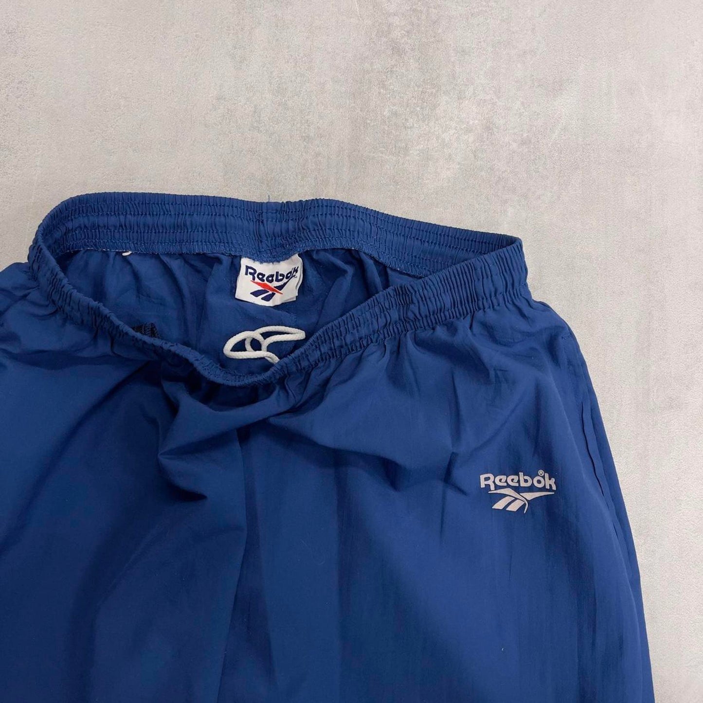 Blue vintage Reebok tracksuit bottoms L