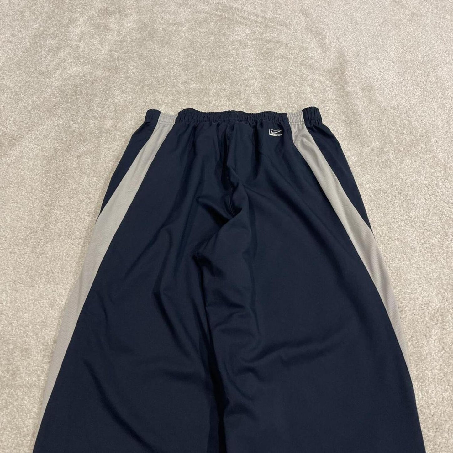 Nike tracksuit bottoms wide leg navy Floaty unlined embroidered side stripe track pants