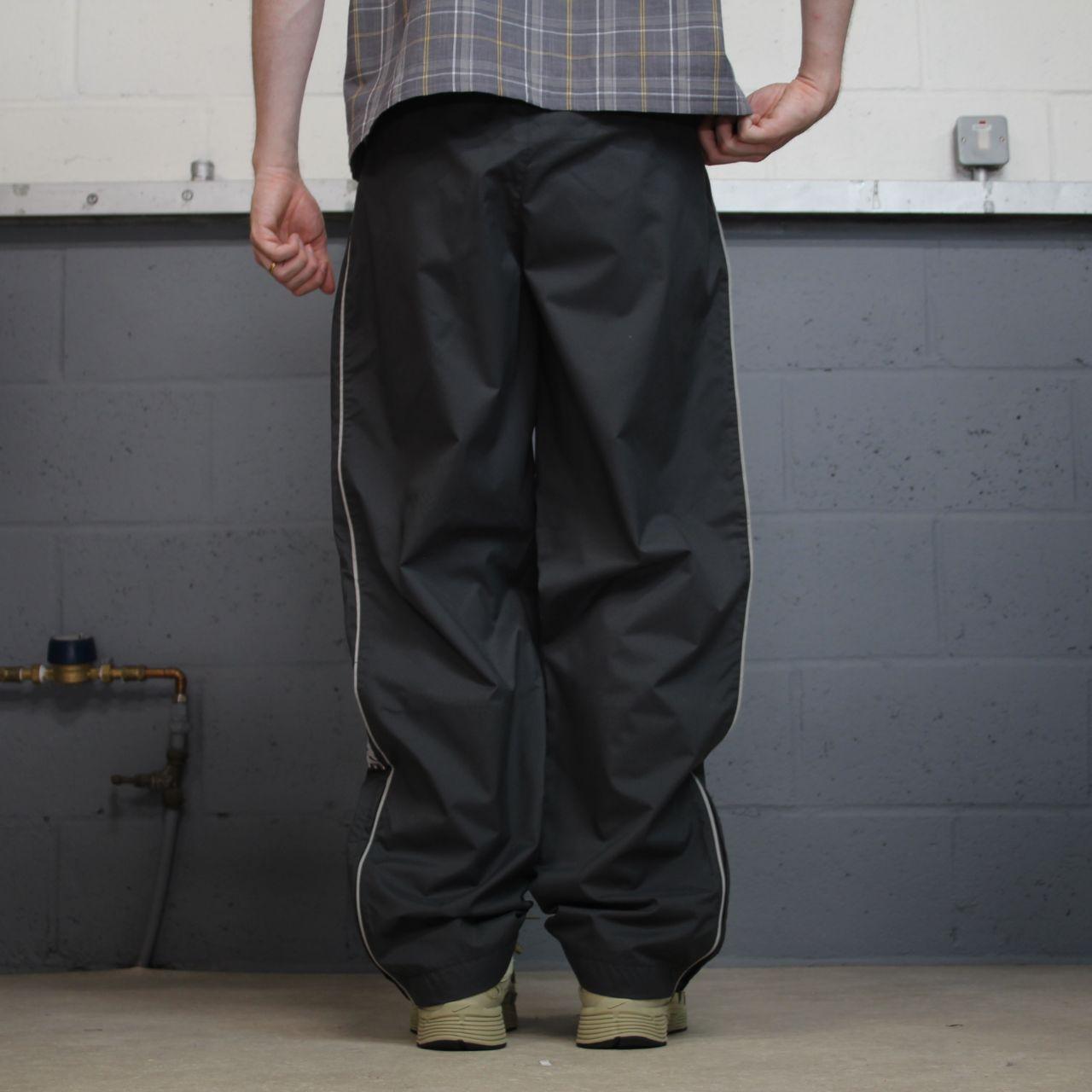 Vintage Nike baggy tracksuit bottoms Y2K grey Wide leg lined embroidered side stripe track pants