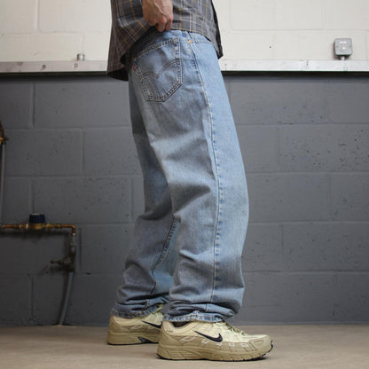Vintage Levi’s baggy jeans y2k W34L32 washed blue Levi’s 550 relaxed fit surf style pants red tab