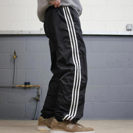 Vintage Y2K Adidas tracksuit bottoms black Loose leg unlined side stripe track pants