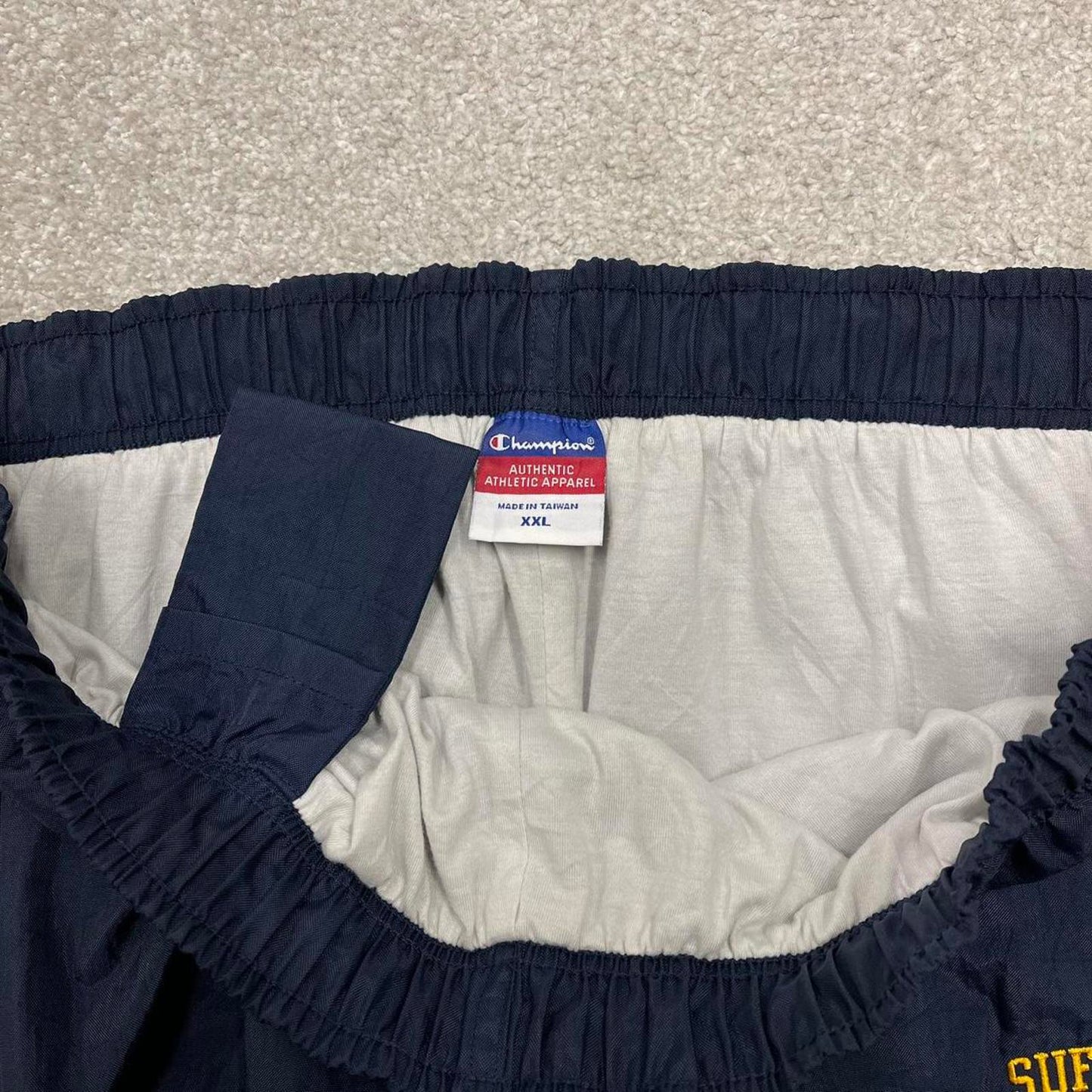 Y2k baggy Champion tracksuit bottoms navy Wide leg track pants embroidered logos popper legs
