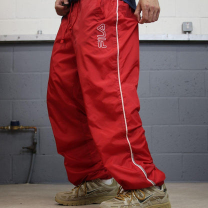 FILA tracksuit bottoms Y2K black Loose fit mesh lined embroidered side stripe track pants