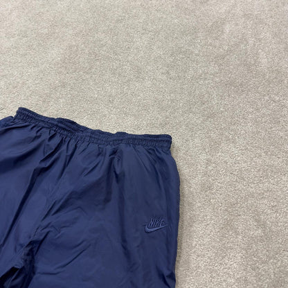 Y2K vintage Nike baggy tracksuit bottoms navy Loose leg 2000s style casual swoosh logo track pants