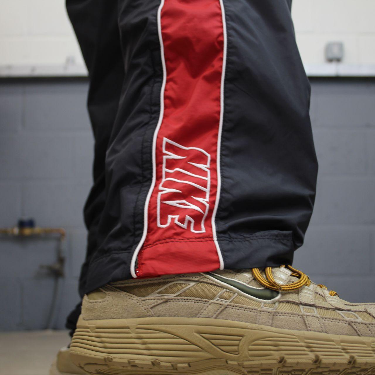 Vintage Nike baggy tracksuit bottoms Y2K black Wide leg lined embroidered side stripe track pants