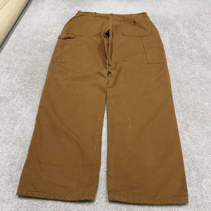 Vintage baggy Carhartt carpenter jeans tan 90s skater style W34L32 flannel lined carpenters