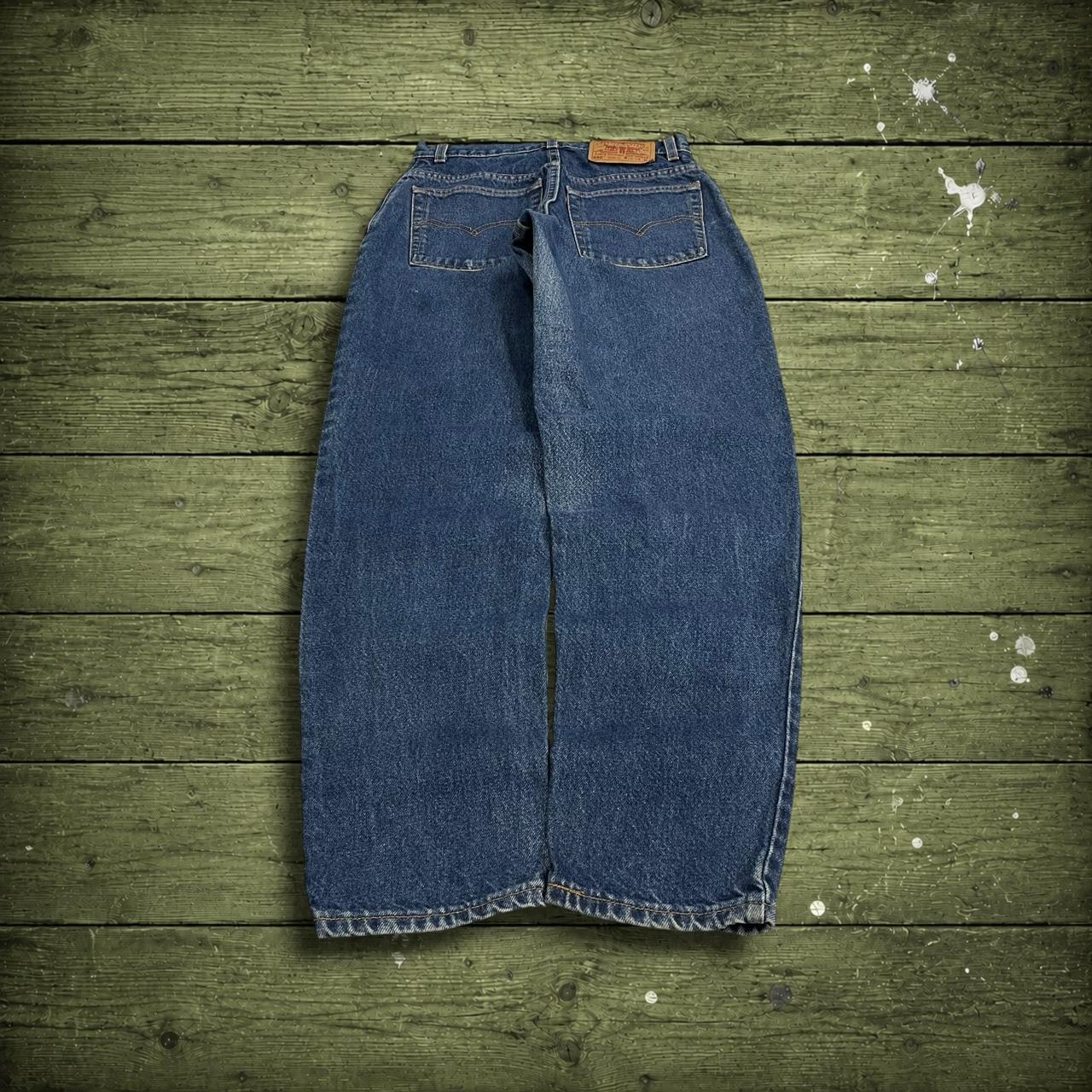 Y2K vintage Levi’s 550 jeans W26L31 blue Relaxed fit tapered leg 5 pocket pants red tab logo