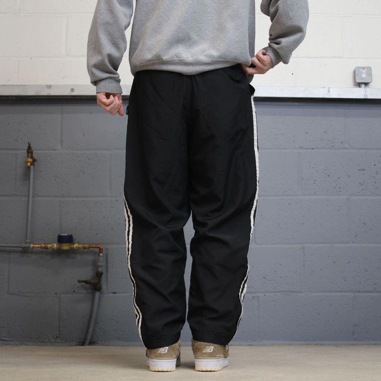 Vintage Y2K Adidas tracksuit bottoms black Loose leg mesh lined side stripe track pants