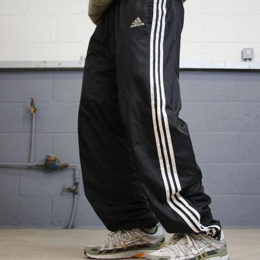 Black Adidas tracksuit bottoms Large y2k style sportswear track pants side stripe design