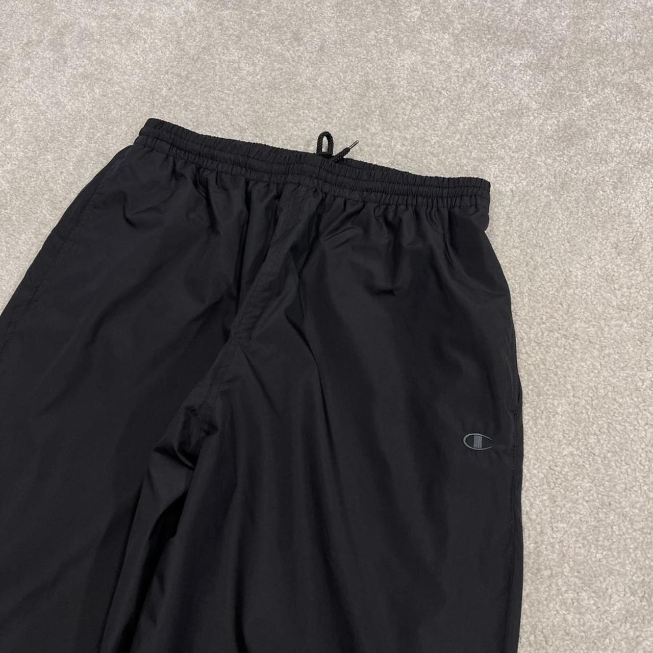 Champion baggy tracksuit bottoms wide leg black Mesh lined embroidered logo gym wear track pants