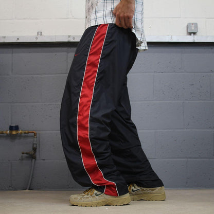 Vintage Nike baggy tracksuit bottoms Y2K black Wide leg lined embroidered side stripe track pants