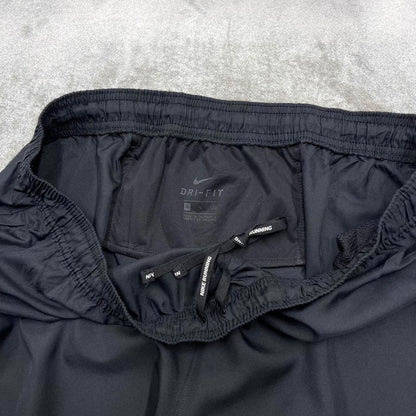 Vintage y2k Nike tracksuit bottoms black Floaty swoosh logo running track pants