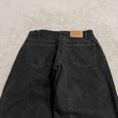 Vintage Levi's 560 jeans y2k black Loose fit denim pants red tab logo