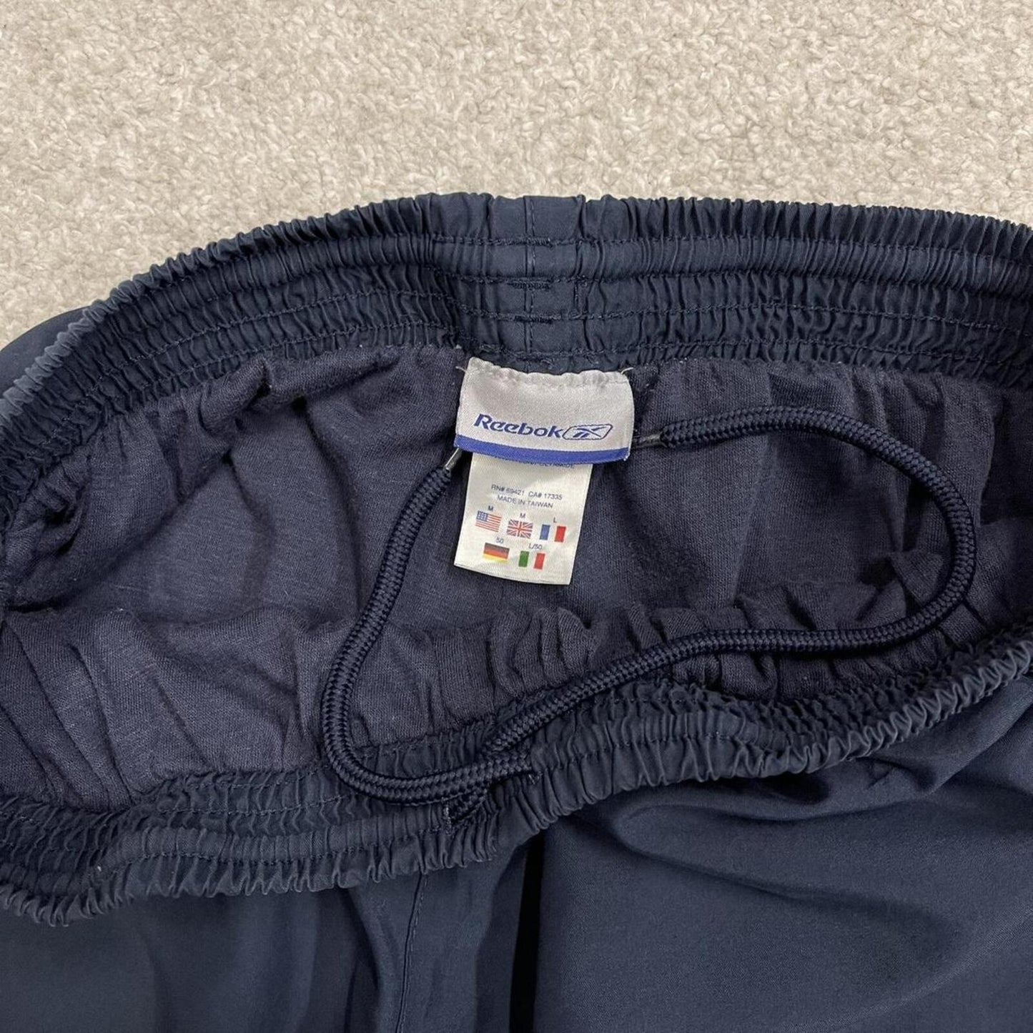 Baggy Reebok tracksuit bottoms vintage wide leg navy Loose embroidered side stripe track pants