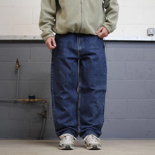 Vintage Y2K Levi’s 550 jeans blue W38L30 Loose straight leg 00s style denim pants red tab logo