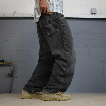 Levi’s 550 jeans Y2K relaxed fit denim faded black Levi’s loose leg 2000s style pants red tab logo