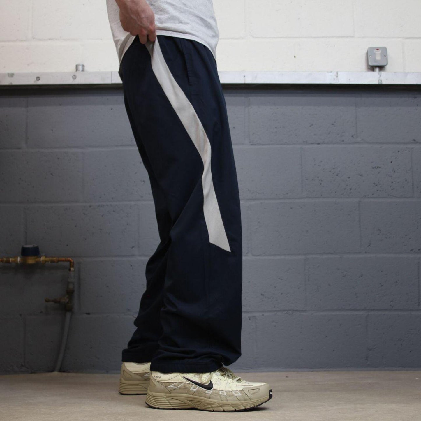 Nike tracksuit bottoms wide leg navy Floaty unlined embroidered side stripe track pants