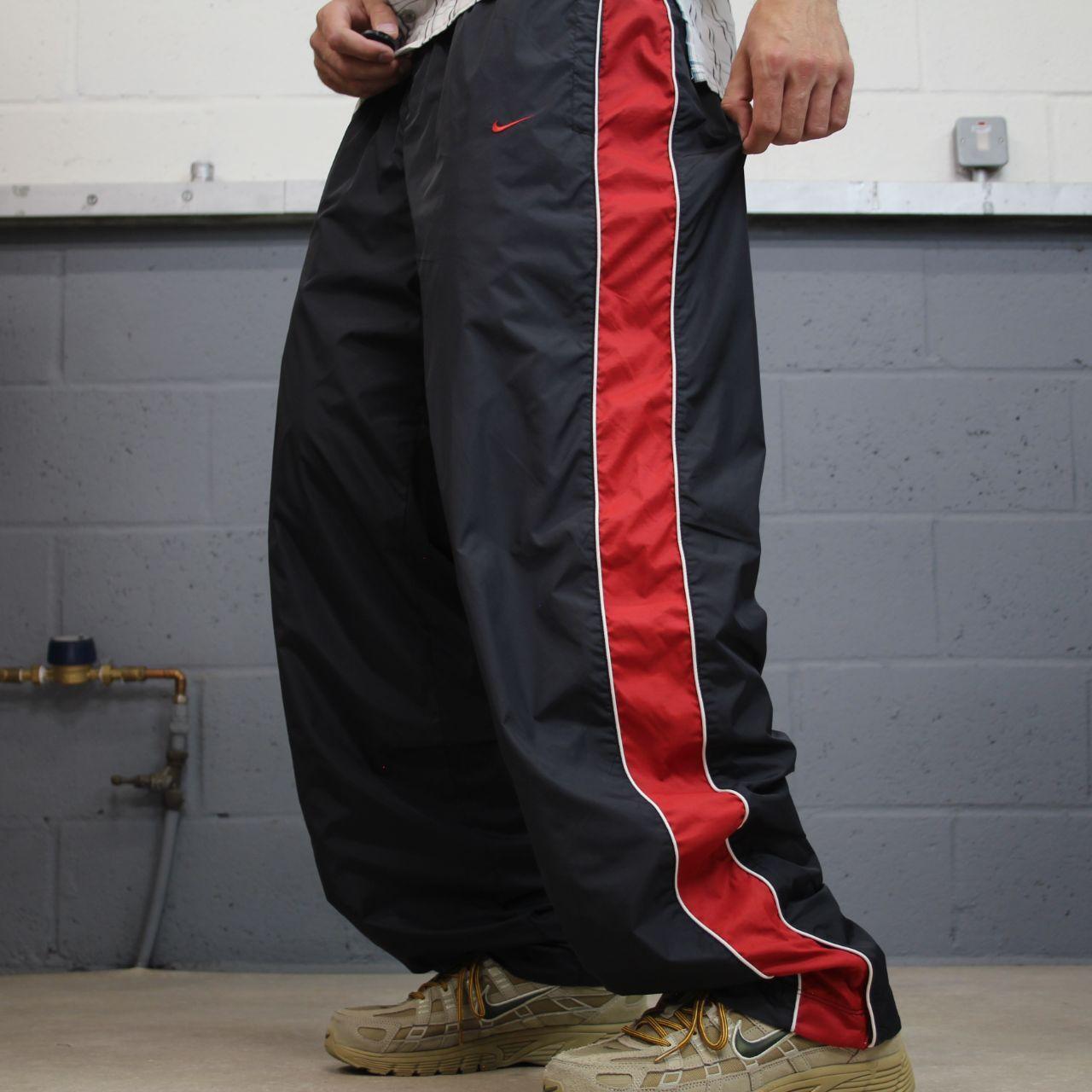 Vintage Nike baggy tracksuit bottoms Y2K black Wide leg lined embroidered side stripe track pants