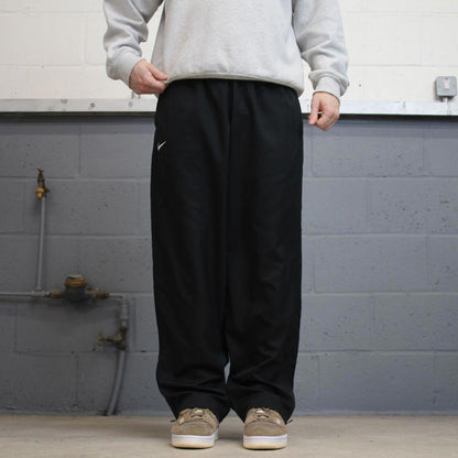 Baggy Nike Trackies L black y2k 00s style loose wide leg joggers embroidered swoosh logo
