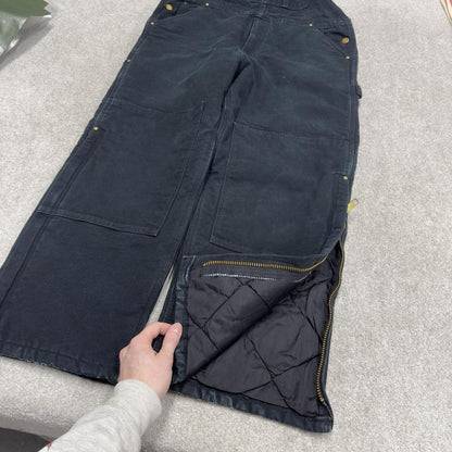Vintage y2k Carhartt dungarees loose leg faded black Canvas quilt lined bib & brace overalls