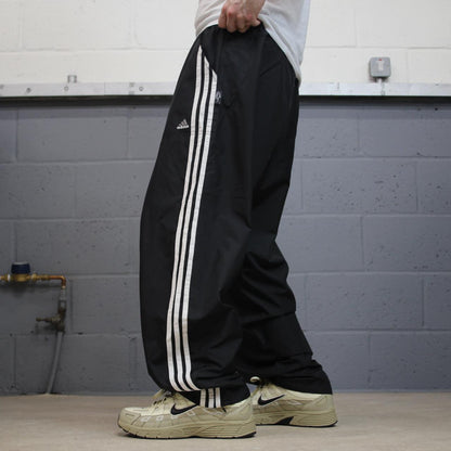 Vintage Adidas tracksuit bottoms loose black Loose floaty embroidered side stripe track pants