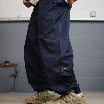 Vintage Nike tracksuit bottoms Y2K navy Loose leg unlined embroidered swoosh track pants
