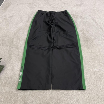 Vintage baggy Nike tracksuit bottoms black Wide leg mesh lined embroidered side stripe track pants