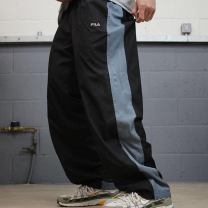FILA tracksuit bottoms loose leg black Vintage lined embroidered side stripe track pants