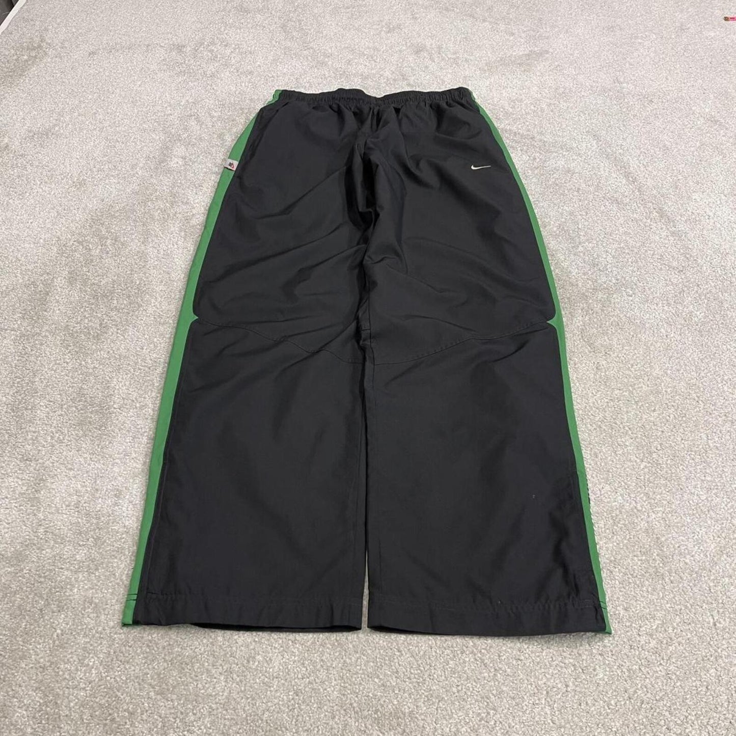 Vintage baggy Nike tracksuit bottoms black Wide leg mesh lined embroidered side stripe track pants
