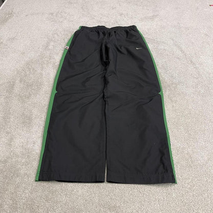 Vintage baggy Nike tracksuit bottoms black Wide leg mesh lined embroidered side stripe track pants