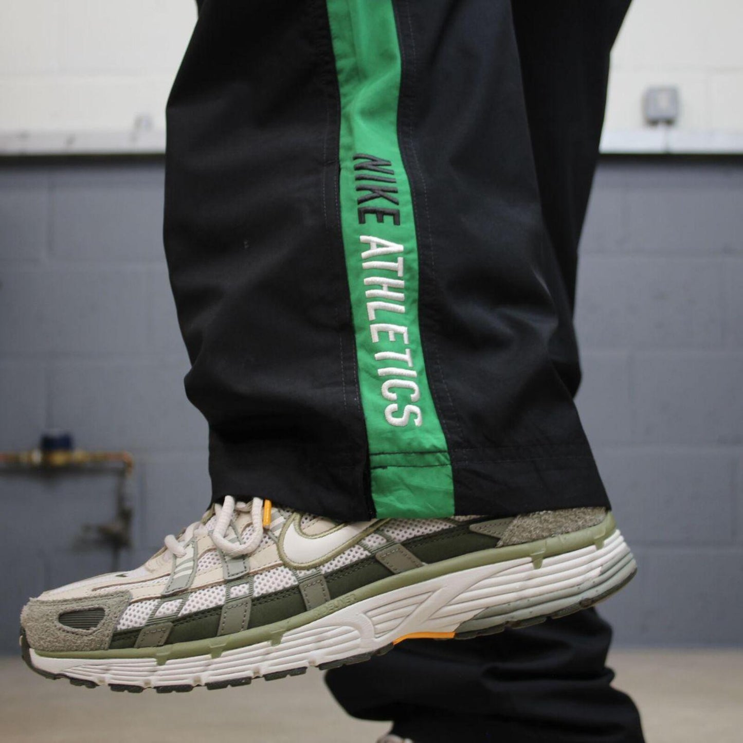 Vintage baggy Nike tracksuit bottoms black Wide leg mesh lined embroidered side stripe track pants