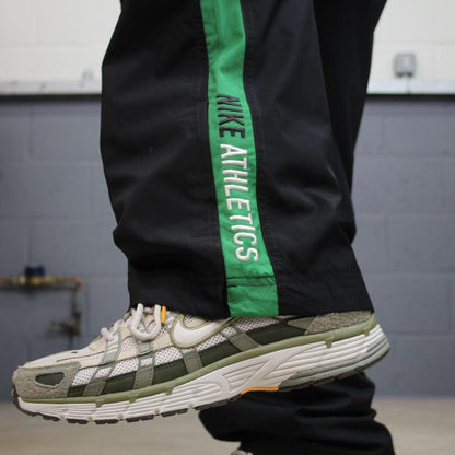 Vintage baggy Nike tracksuit bottoms black Wide leg mesh lined embroidered side stripe track pants