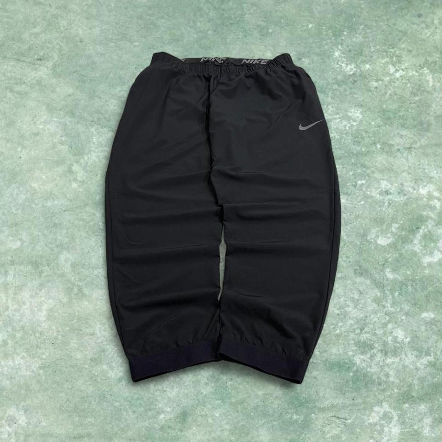 Nike tracksuit bottoms loose fit black Lightweight floaty swoosh logo track pants
