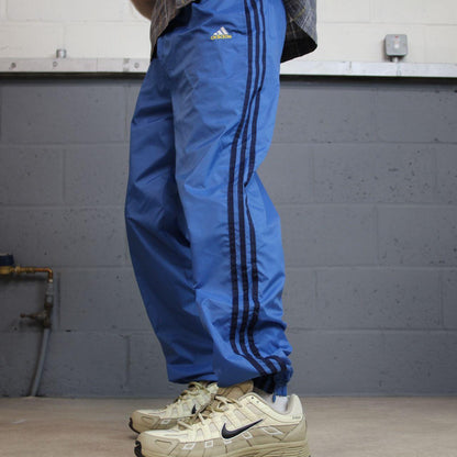 Vintage y2k Adidas tracksuit bottoms blue Loose leg embroidered side stripe 2000s style track pants