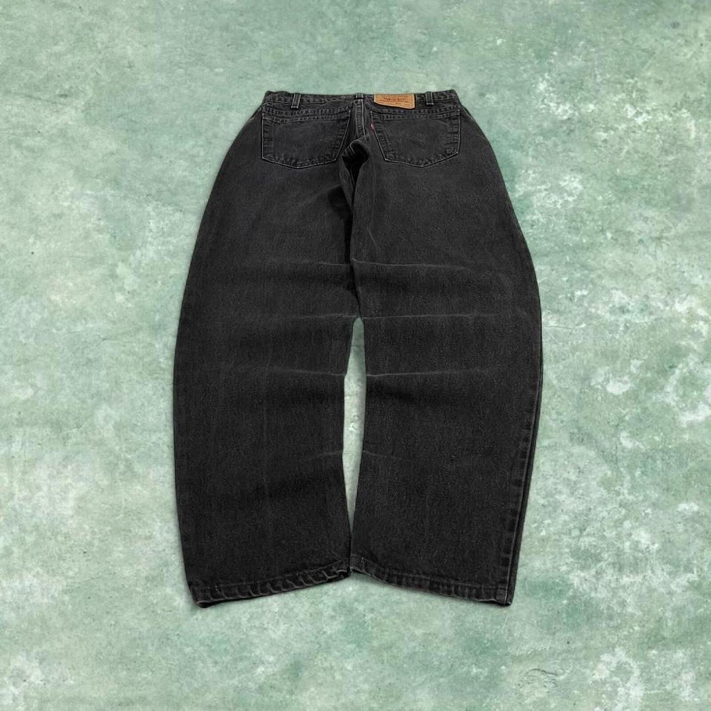 Vintage Levi's 560 jeans loose fit tapered leg black USA made 100% cotton denim pants red tab logo