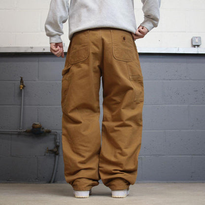 Vintage baggy Carhartt carpenter jeans tan 90s skater style W34L32 flannel lined carpenters