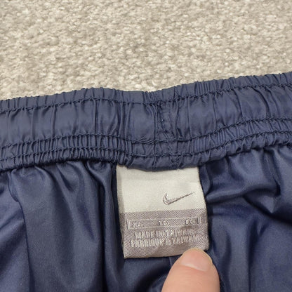 Vintage Nike tracksuit bottoms Y2K navy Loose leg unlined embroidered swoosh track pants
