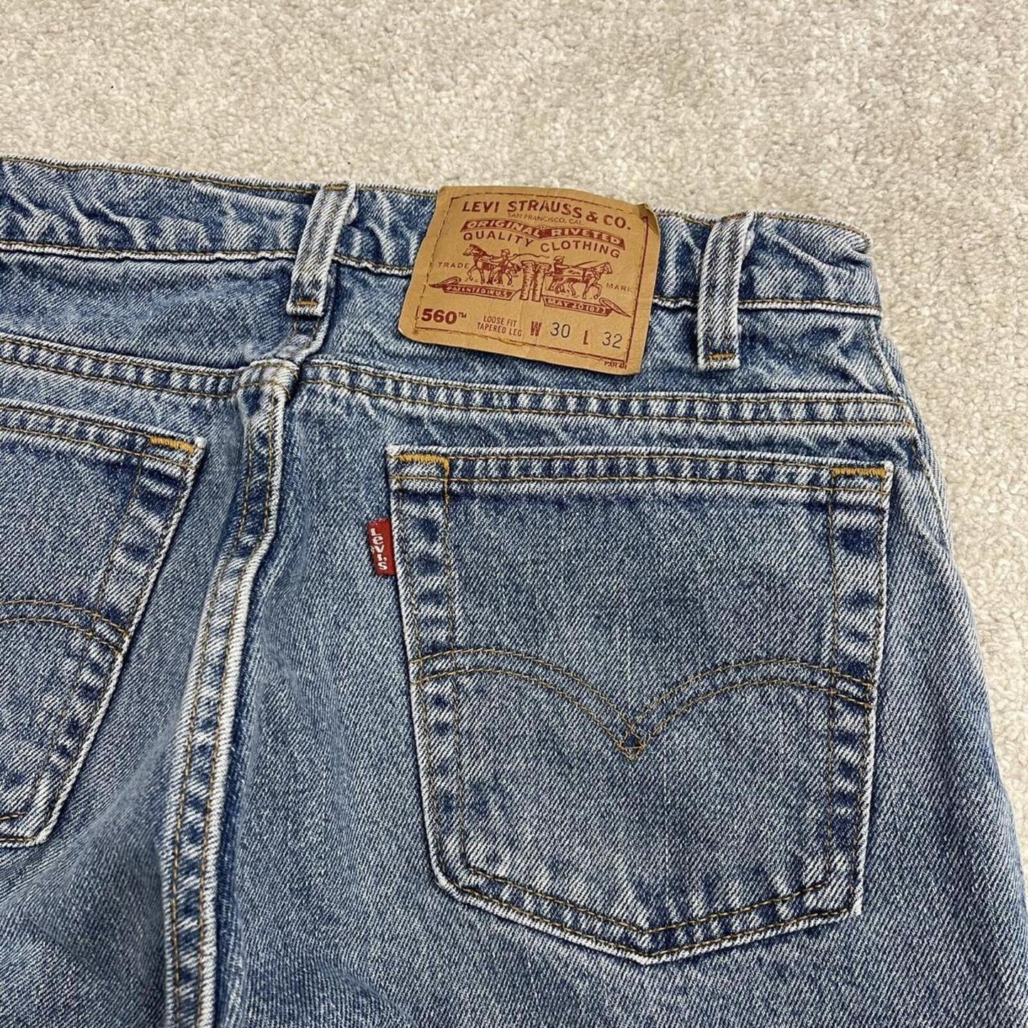 Vintage Levi's jeans 560 loose fit tapered leg blue USA made 100% cotton denim pants red tab logo