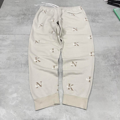 Y2k beige Nike joggers XL loose sweatpants cuffed legs embroidered logo