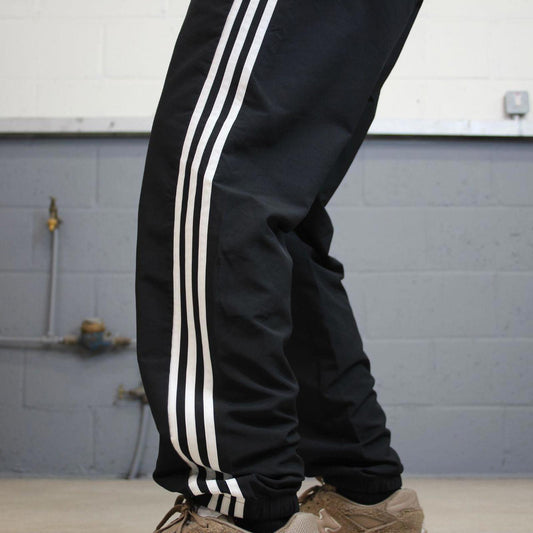 Black Adidas joggers L y2k style sportswear track pants side stripe design