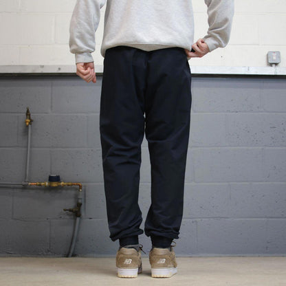 Y2k Nike tracksuit bottoms loose navy Loose unlined embroidered cuffed track pants