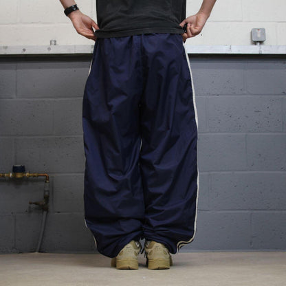 Vintage Y2K baggy Adidas tracksuit bottoms navy Loose-leg embroidered lined side stripe track pants