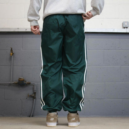 Green Adidas Team trackies M y2k style sportswear track pants embroidered logo side stripe design