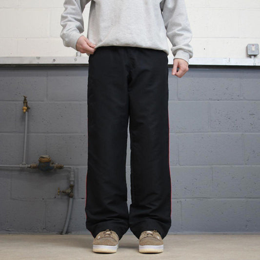 Vintage Womens black Reebok joggers 14 y2k style sportswear track pants side stripe design