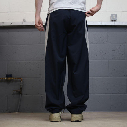 Nike tracksuit bottoms wide leg navy Floaty unlined embroidered side stripe track pants