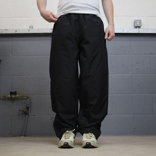 Champion baggy tracksuit bottoms wide leg black Mesh lined embroidered logo gym wear track pants