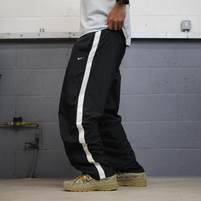 Nike tracksuit bottoms Y2K black Loose fit mesh lined embroidered side stripe track pants