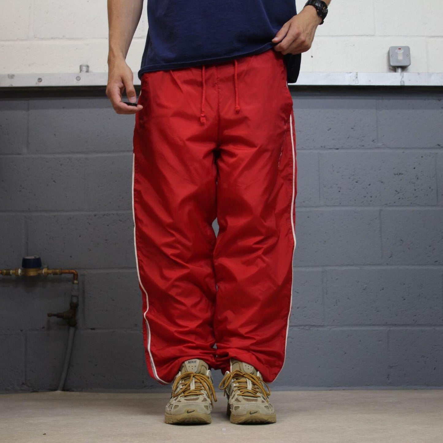 FILA tracksuit bottoms Y2K black Loose fit mesh lined embroidered side stripe track pants