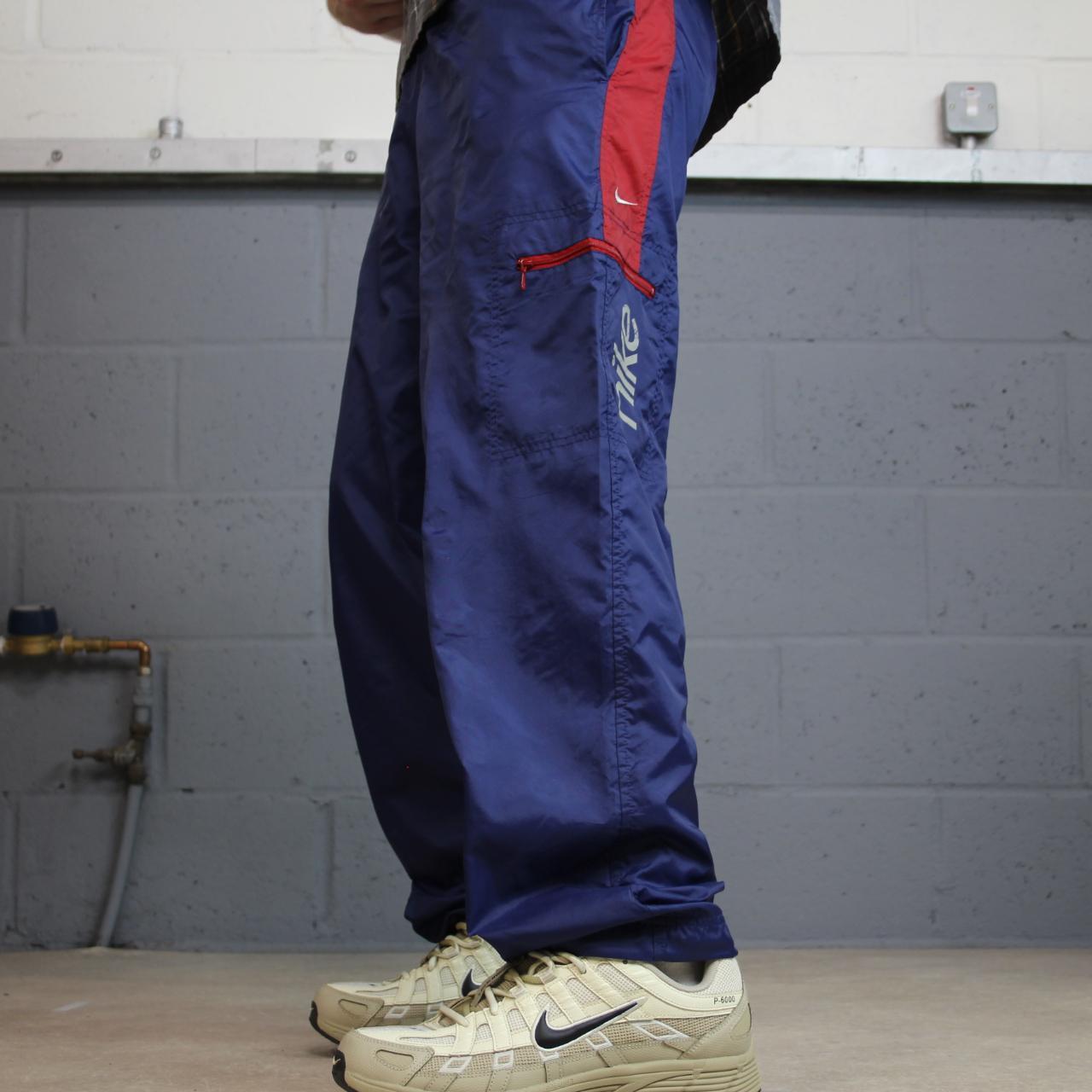 Y2K vintage Nike baggy tracksuit bottoms navy Loose leg 2000s style casual swoosh logo track pants